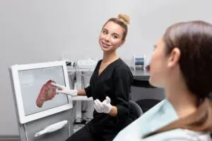 Dentist showing a patient a digital dental scan